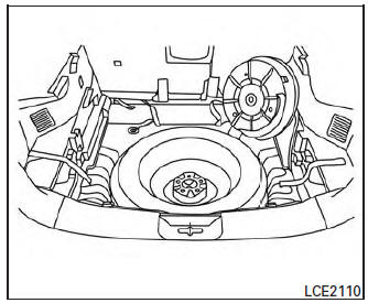 Changing the spare tire with BOSE® sub-woofer